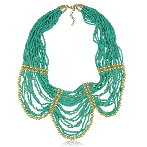 Turquoise multi strand seed bead statement necklace with gold metal beads and extender chain