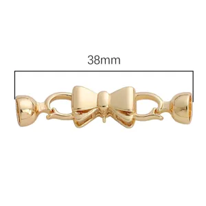 Gold tone bow jewelry clasp connector for DIY necklaces, bracelets and accessories.