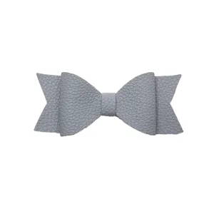 Grey faux leather bow detail close-up, elegant accessory decoration for daily design.