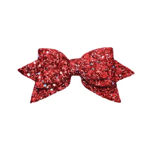 Red glitter bow accessory detail shot, sparkling sequin bowknot for creative cup decoration.