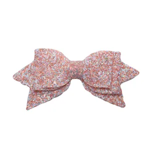 Glitter bow accessory detail view, sparkling pink sequin decoration for cups or crafts.