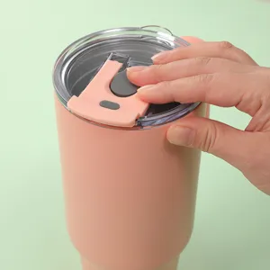 Detail view of pink 40oz insulated tumbler with lid, stainless steel vacuum travel mug.