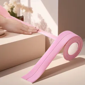 Pink waterproof sealing strip detail showing flexible adhesive tape for kitchen corner joints.