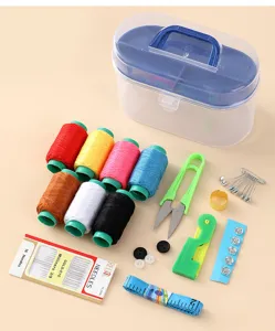 Portable sewing kit set with plastic storage box, colorful threads, needles, and tools.
