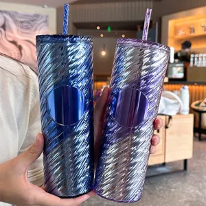 Detail shot of 20oz gradient iridescent spiral plastic tumbler with straw and logo badge.