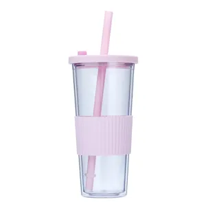 Detail view of the clear double wall plastic tumbler with pink silicone sleeve and matching straw.
