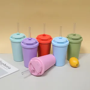 Close-up detail shot of colorful insulated straw cups in multiple vibrant shades on table.