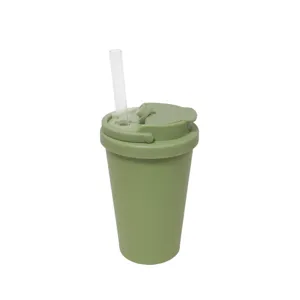 Close-up detail of the green insulated straw cup lid structure and transparent drinking straw.