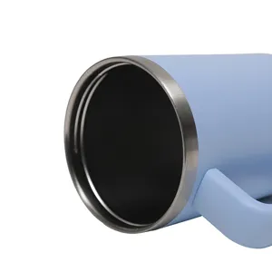 Stainless steel insulated travel mug detail shot, portable car water cup with handle and blue finish.