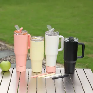 Stainless steel tumbler detail showing colorful insulated car cups with handle and straw.