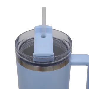 Close up detail of the stainless steel tumbler lid, straw insertion and portable handle design.