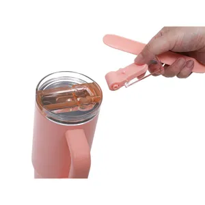 Detailed shot of a pink stainless steel tumbler showing removable straw lid and handle design.