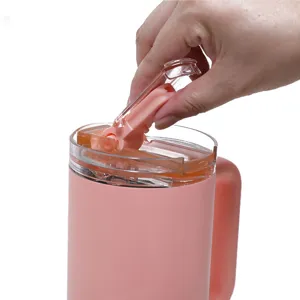 Detachable lid detail of pink insulated car tumbler showing easy cleaning and practical design