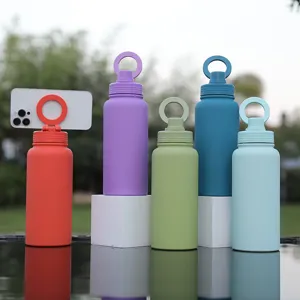 Outdoor scene detail showing colorful water bottles with innovative magnetic phone holder cap.