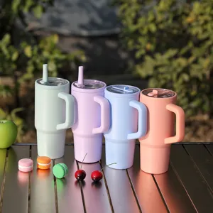 Stainless steel tumbler with handle and straw lid, 710ml insulated water cup for daily use.