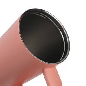 Detailed view of the pink insulated stainless steel mug interior and handle structure.