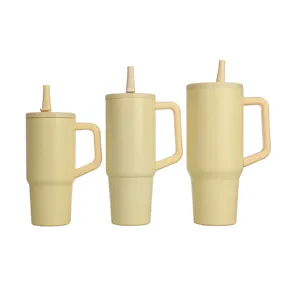 Stainless steel insulated tumbler with handle and straw in three sizes, beige color.