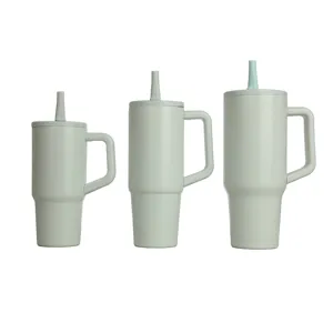 Insulated tumbler with handle and straw, stainless steel travel mug set in light green color.