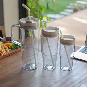 Large capacity 40oz plastic tumbler cup set with straw and handle for daily use and travel.