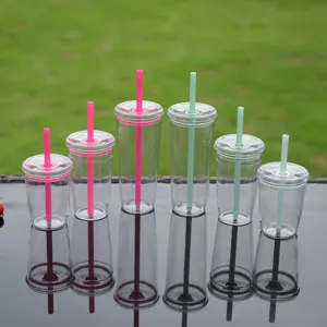 Detail shot of clear tritan straw cups in various heights with vibrant pink and green straws.