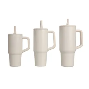 Detailed view of three beige insulated car tumbler cups with handles and straws in multiple sizes.