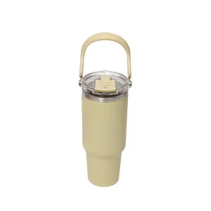 Large capacity insulated stainless steel travel tumbler with convenient handle and straw lid.