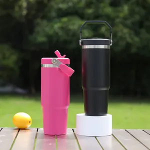 Portable 30oz stainless steel insulated car tumbler with handle and straw lid for travel.