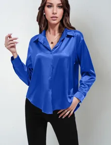 Detailed view of the elegant royal blue satin long sleeve button up shirt cuff and collar.