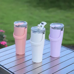 Stainless steel insulated tumbler with handle and clear lid, portable travel water bottle.