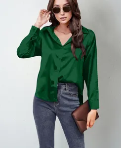 Close-up view of dark green satin button-down shirt detail, smooth fabric texture and long sleeves.