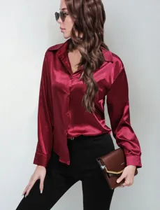 Women's burgundy satin long sleeve button-up shirt detail, elegant office lapel top.