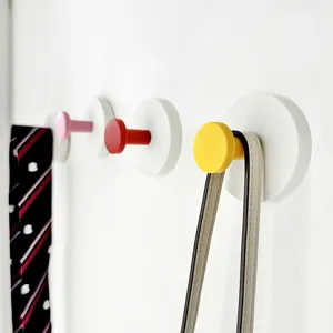 Minimalist punch-free round wall hook detail view, showing colorful hanging knobs and daily use.