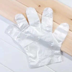 Gants jetables transparents pour le nettoyage domestique, les soins de beauté et la sécurité.
