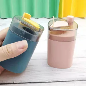 Automatic press-type plastic toothpick dispenser box holder, convenient home desktop container.