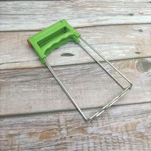 Stainless steel anti-scalding bowl gripper kitchen tool detail view, green double handle.