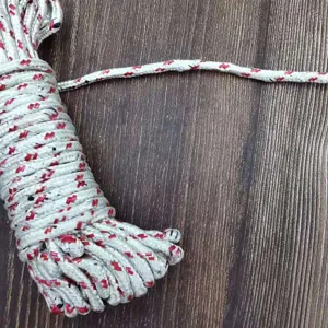Detailed shot of heavy-duty braided nylon clothesline with red anti-slip pattern.