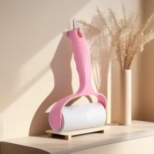 Pink sticky lint roller detail view, portable clothes hair remover with stand for daily home use.