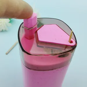 Close-up detail of the automatic plastic toothpick dispenser, press style container for home use.