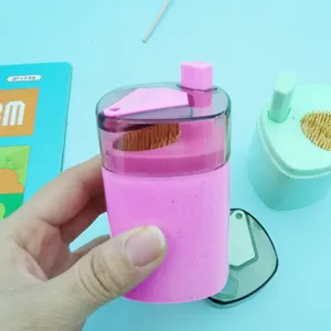 Automatic press toothpick dispenser detail view, convenient plastic toothpick holder container.