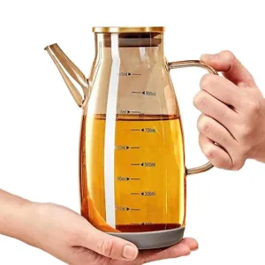 Bottiglia dispenser per olio in vetro borosilicato con scala graduata per cucina.