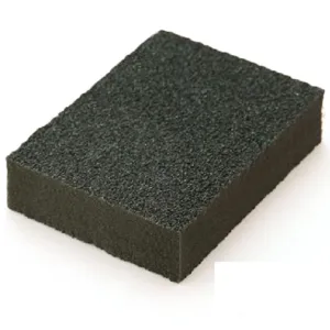 Detail shot of the black carborundum cleaning sponge surface texture and high density material.