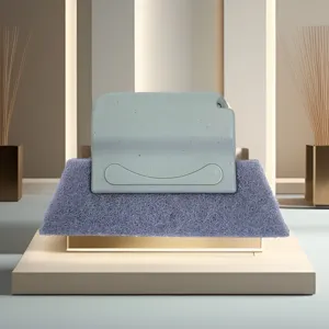 Detailed view of the window groove cleaning brush with a blue handle and scouring pad.