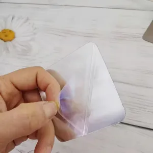 Transparent adhesive hook detail view, showing high strength backing and easy peel film.