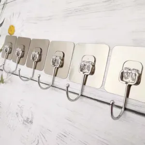 Multifunctional traceless adhesive wall hooks detail showing sturdy metal brushed coat hooks.