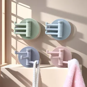 Rotatable 3-prong wall hook for kitchen and bathroom, self-adhesive multi-branch design.