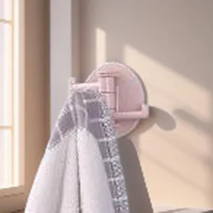 Detail view of the pink 3-branch rotating wall hook, perfect for kitchen and bathroom storage.