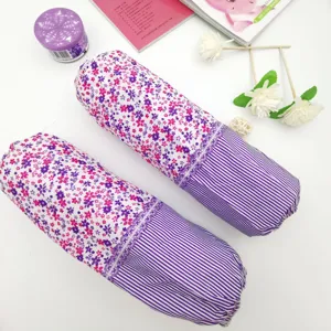 Floral and striped pattern detail of arm sleeves, cleaning protection close-up view