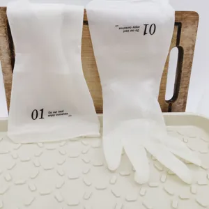 White waterproof rubber household cleaning gloves for washing dishes and doing housework.