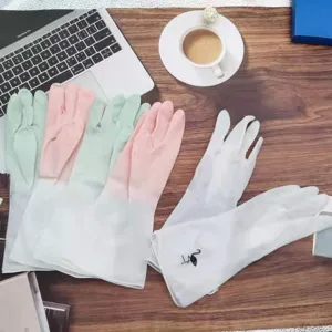 Detailed view of household cleaning rubber gloves in multiple colors displayed on wooden desk.