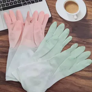 Detailed view of household rubber cleaning gloves in pink and green, water-resistant for daily chores.